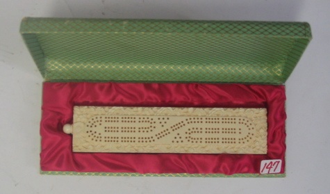 Appraisal: A CHINESE CARVED IVORY CASED CRIBBAGE BOARD flowers and foliage