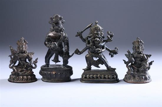 Appraisal: THREE TIBETAN BRONZE FIGURES OF BODHISATTVA One standing on lotus