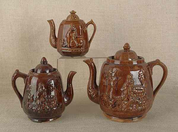 Appraisal: Three Rockingham glaze teapots one impressed Rebekah at the Well