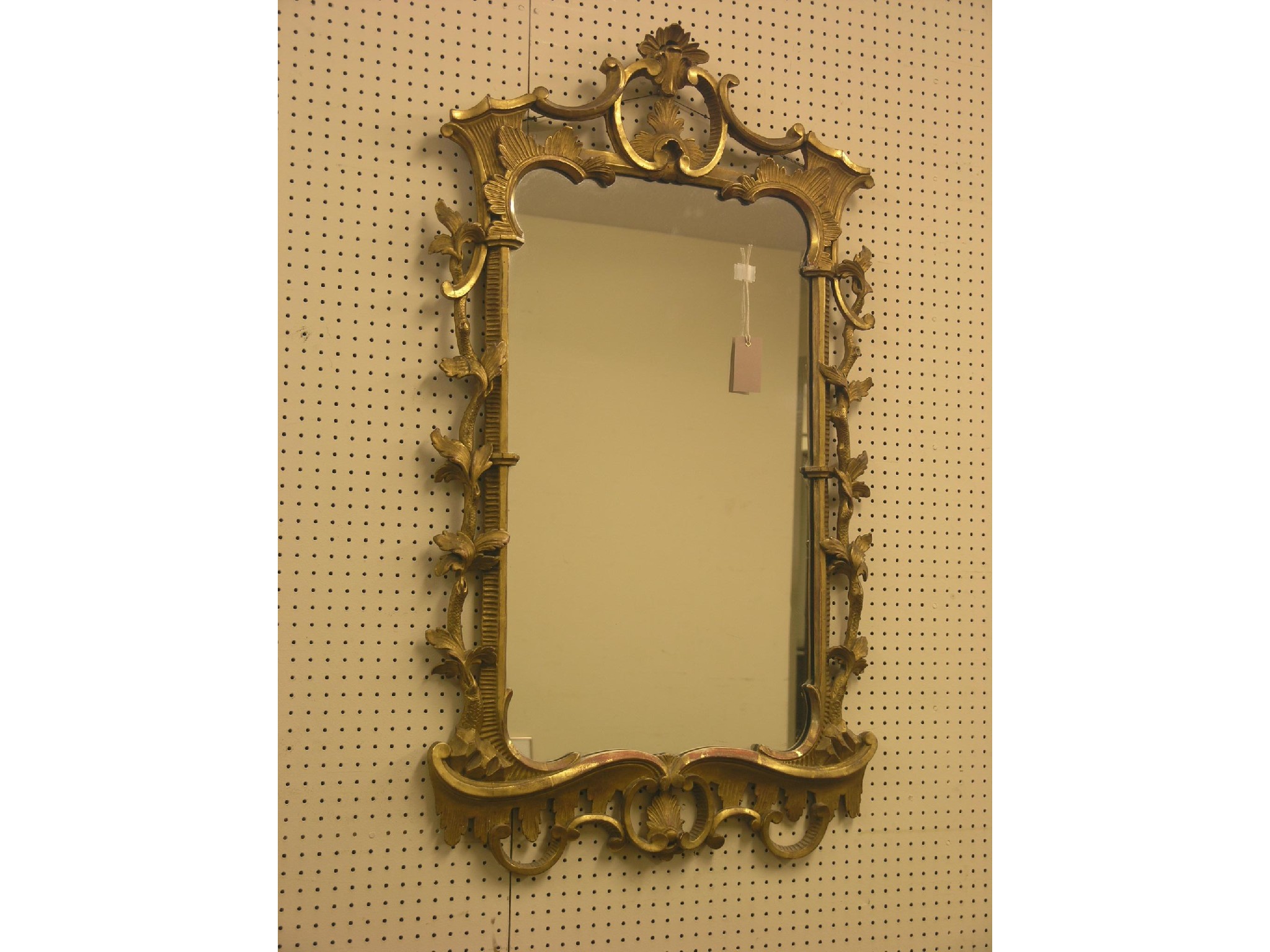 Appraisal: A Chippendale-style giltwood mirror rectangular frame elaborately carved with acanthus