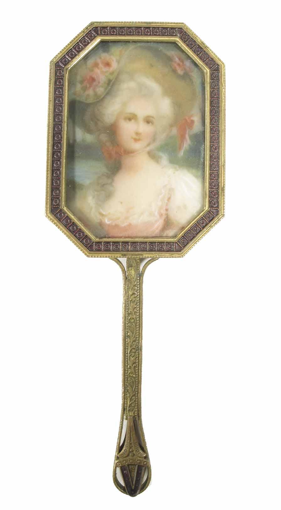 Appraisal: A gilt brass miniature dressing table hand mirror