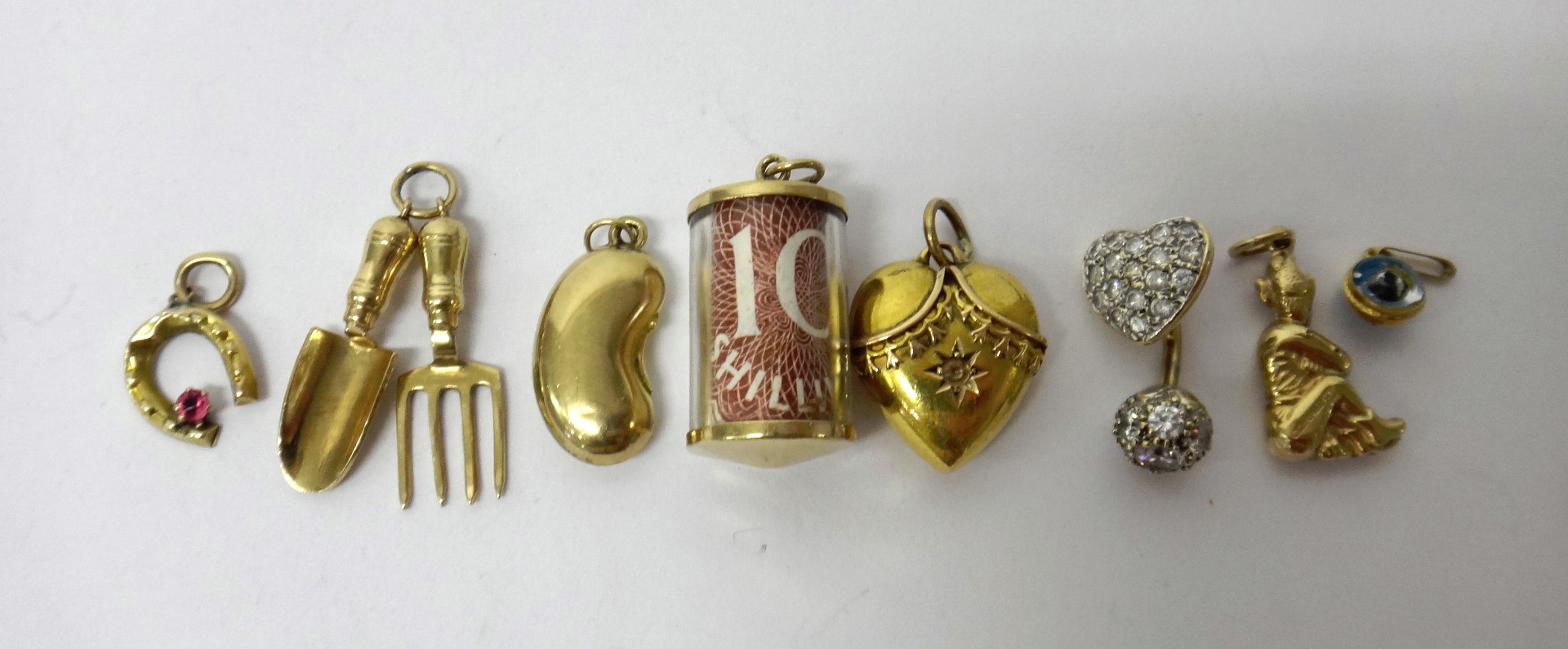 Appraisal: A Victorian gold heart shaped pendant detailed indistinctly six mostly