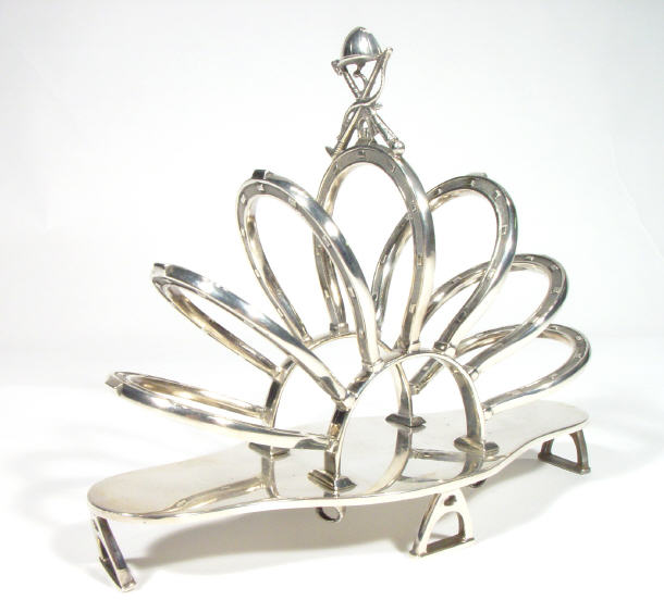 Appraisal: Victorian silver plated horseshoe design six slice toast rack with