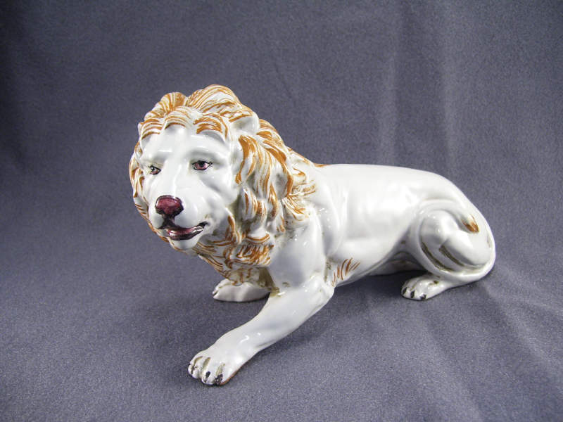 Appraisal: Italian Pottery Figural Lion Heavy white glaze with orange accents