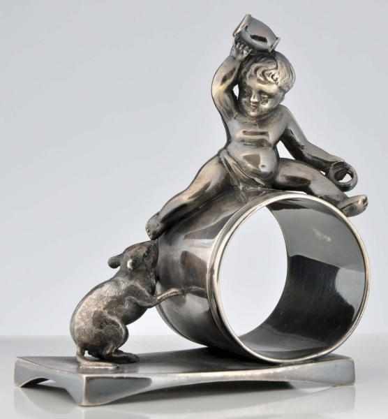 Appraisal: Baby Atop Holder Figural Napkin Ring Baby with cup and