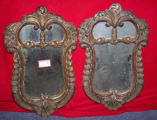 Appraisal: A pair of carved and gilt gesso hall mirrors of