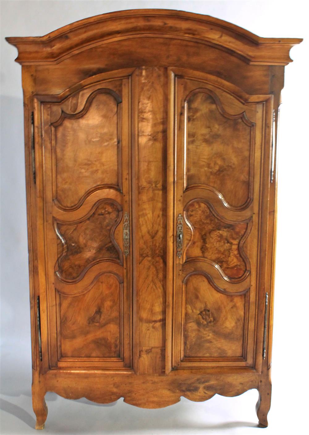 Appraisal: FRENCH PROVINCIAL STYLE ARMOIRE having a molded and arched cornice