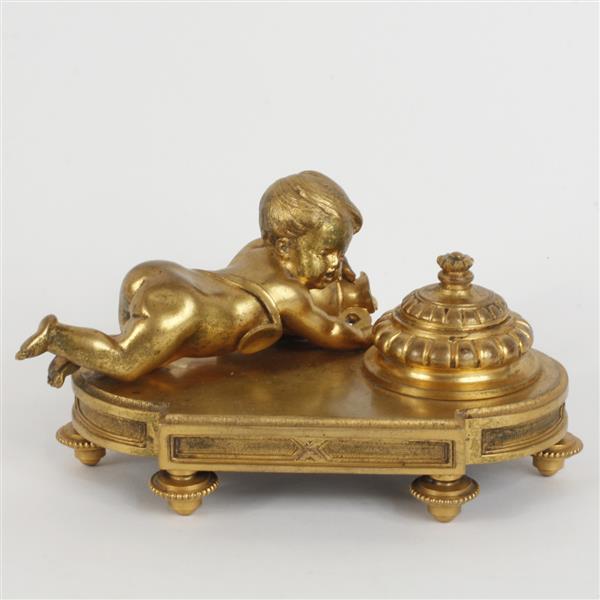 Appraisal: French gilt bronze figural inkwell with putti on shaped footed