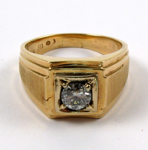 Appraisal: MAN'S DIAMOND AND FOURTEEN KARAT GOLD RING centering a prong