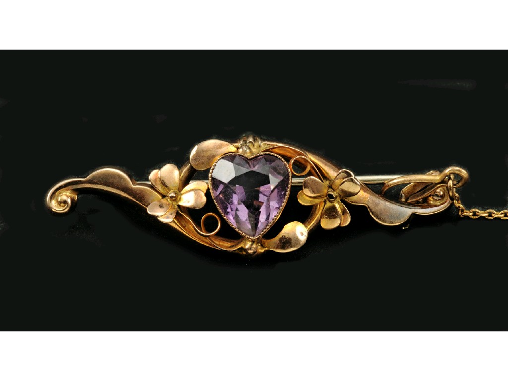 Appraisal: An Amethyst Bar Brooch the heart-cut stone within floral wreath