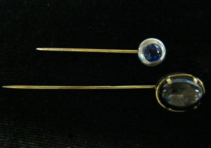 Appraisal: Two gem set stick pinsOne round cut sapphire one oval