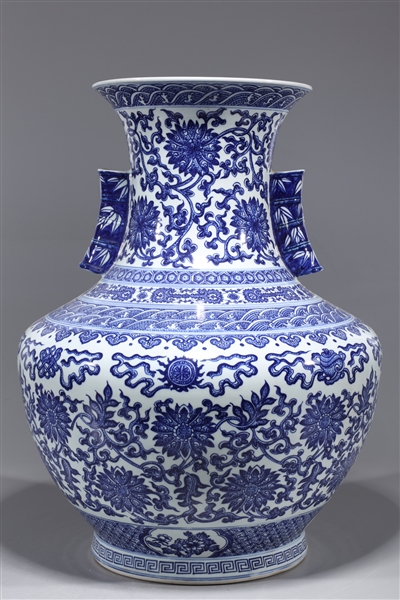 Appraisal: Chinese blue and white porcelain vase with floral designs allover