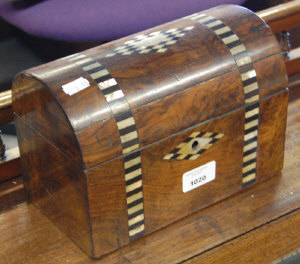 Appraisal: A Victorian walnut domed-top box inlaid with mother-of-pearl and ebony