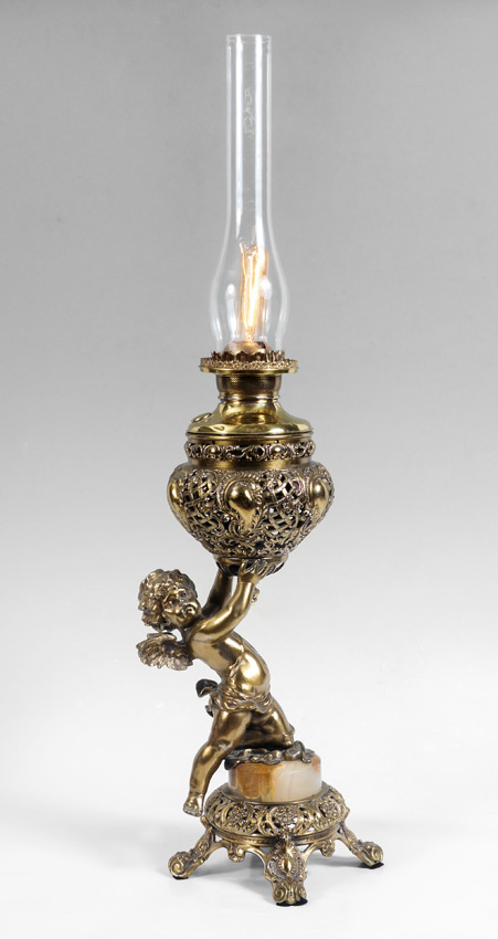 Appraisal: VICTORIAN GILT METAL CHERUB OIL LAMP Electrified figure of a