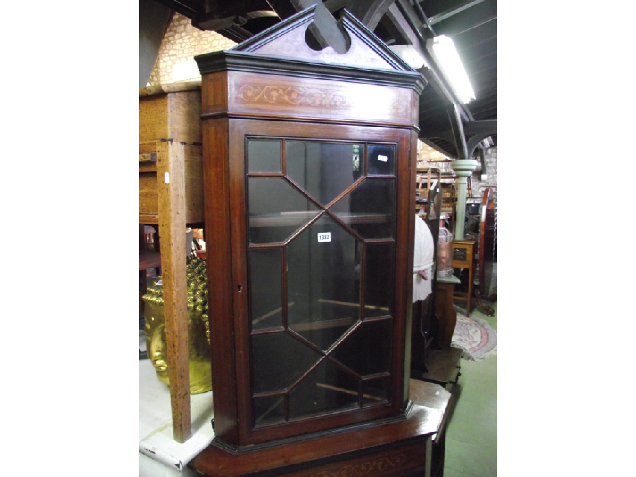 Appraisal: An inlaid Edwardian mahogany freestanding corner cupboard both sections with