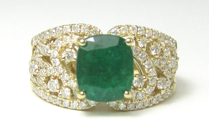 Appraisal: EMERALD DIAMOND AND FOURTEEN KARAT GOLD RING with round-cut diamonds