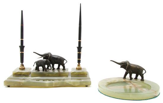 Appraisal: n Onyx and Bronze Vide Poche mounted with elephants together