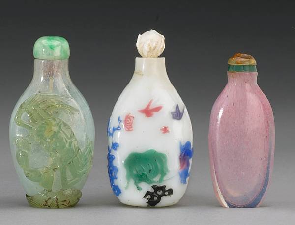 Appraisal: Three Peking glass snuff bottles The first a faint blue-hued