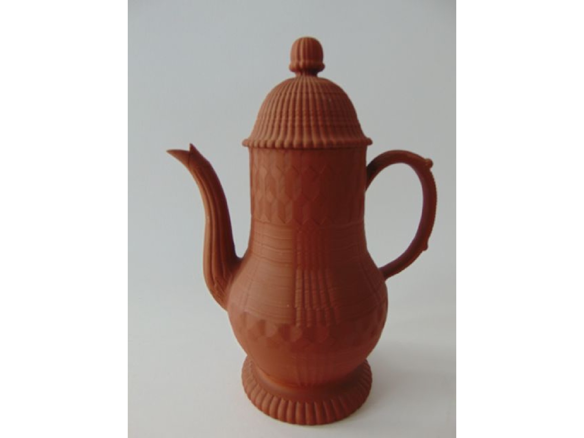 Appraisal: A th century finely potted terracotta coffee pot with fluted