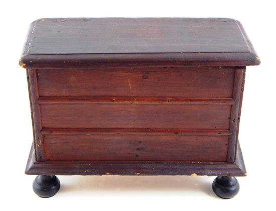 Appraisal: New England primitive miniature blanket chest c pine with dark