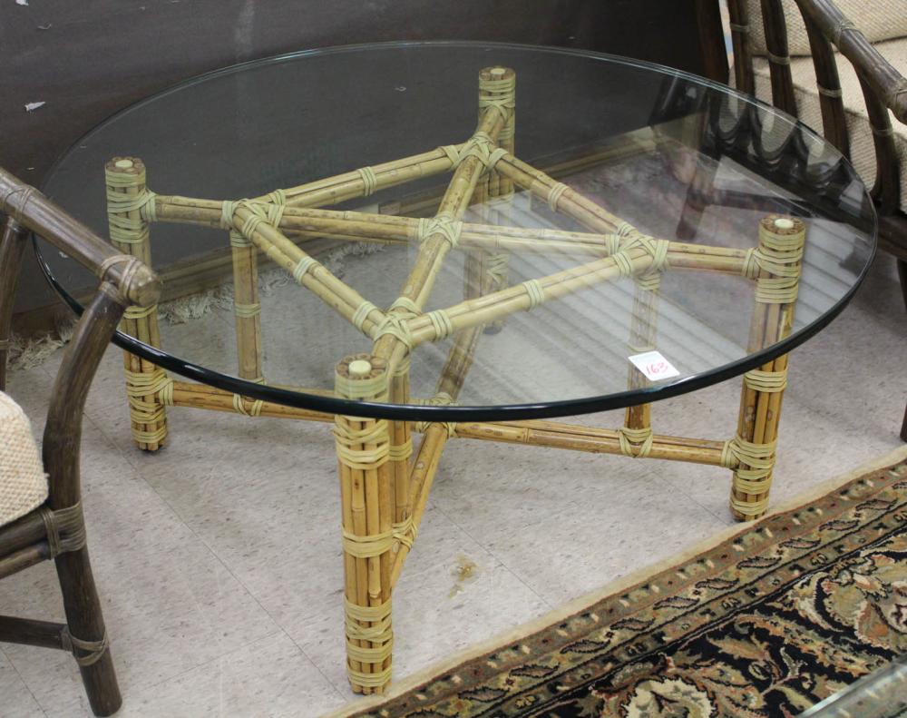 Appraisal: ROUND GLASS-TOP McGUIRE COFFEE TABLE McGuire Furniture Co San Francisco