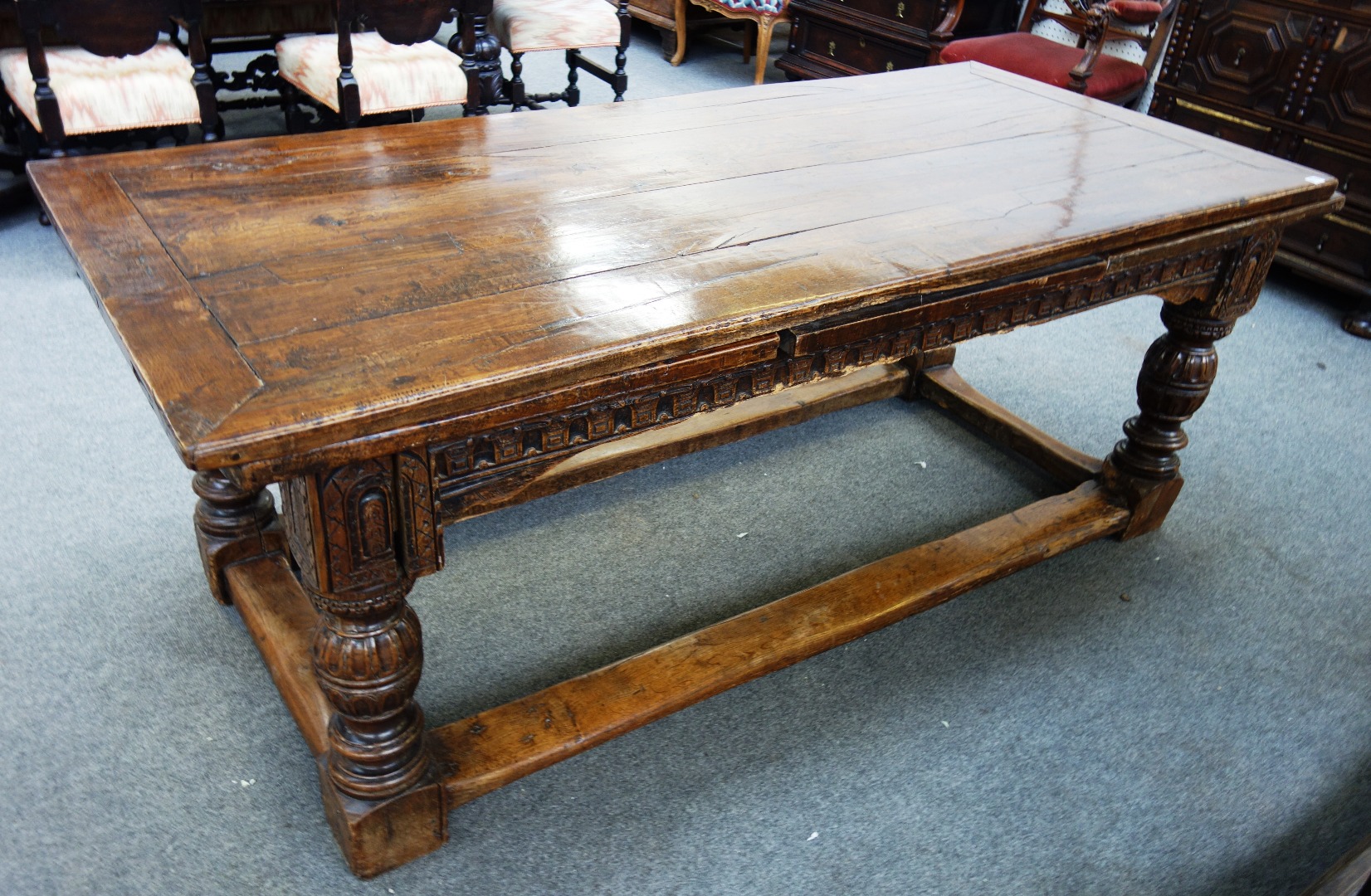 Appraisal: An oak draw leaf table on carved cup and cover