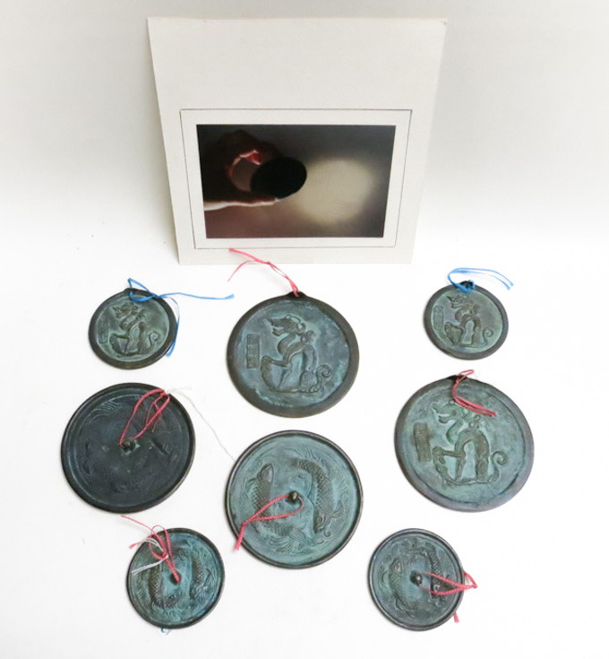 Appraisal: SEVEN CHINESE BRONZE MAGIC MIRRORS circular form with one side