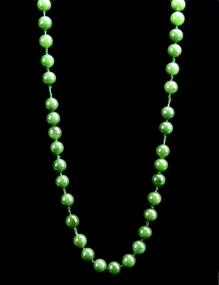 Appraisal: Jadeite Bead Necklace Composed of green jadeite beads of good