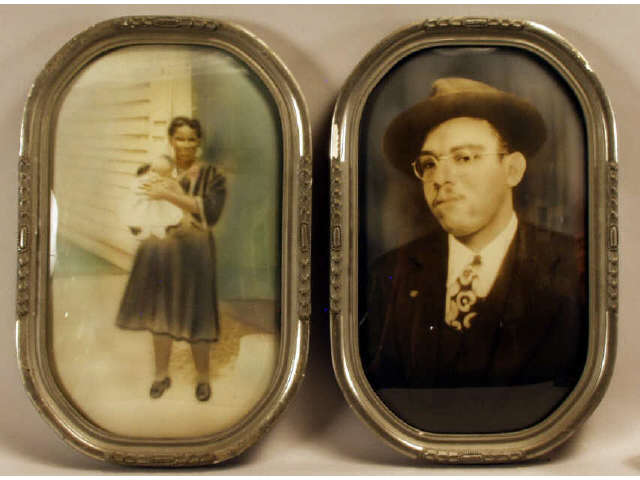 Appraisal: Two hand tinted photos in original convex frames of black