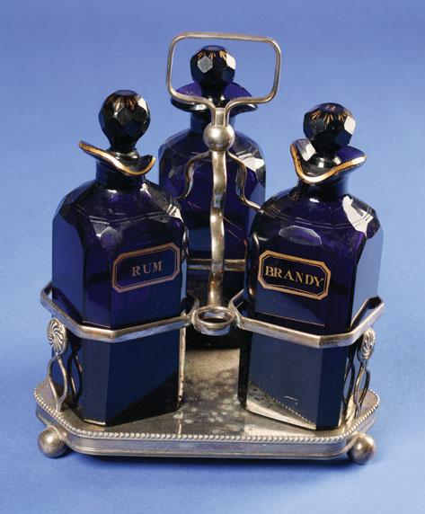 Appraisal: A SET OF THREE BRISTOL BLUE DECANTERS of square form