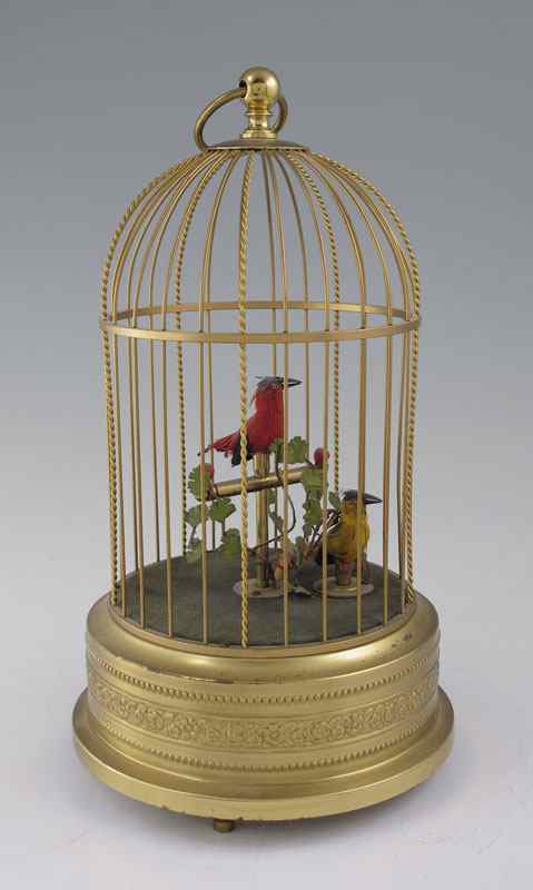 Appraisal: SINGING BIRD AUTOMATON Two birds in a brass cage Winding