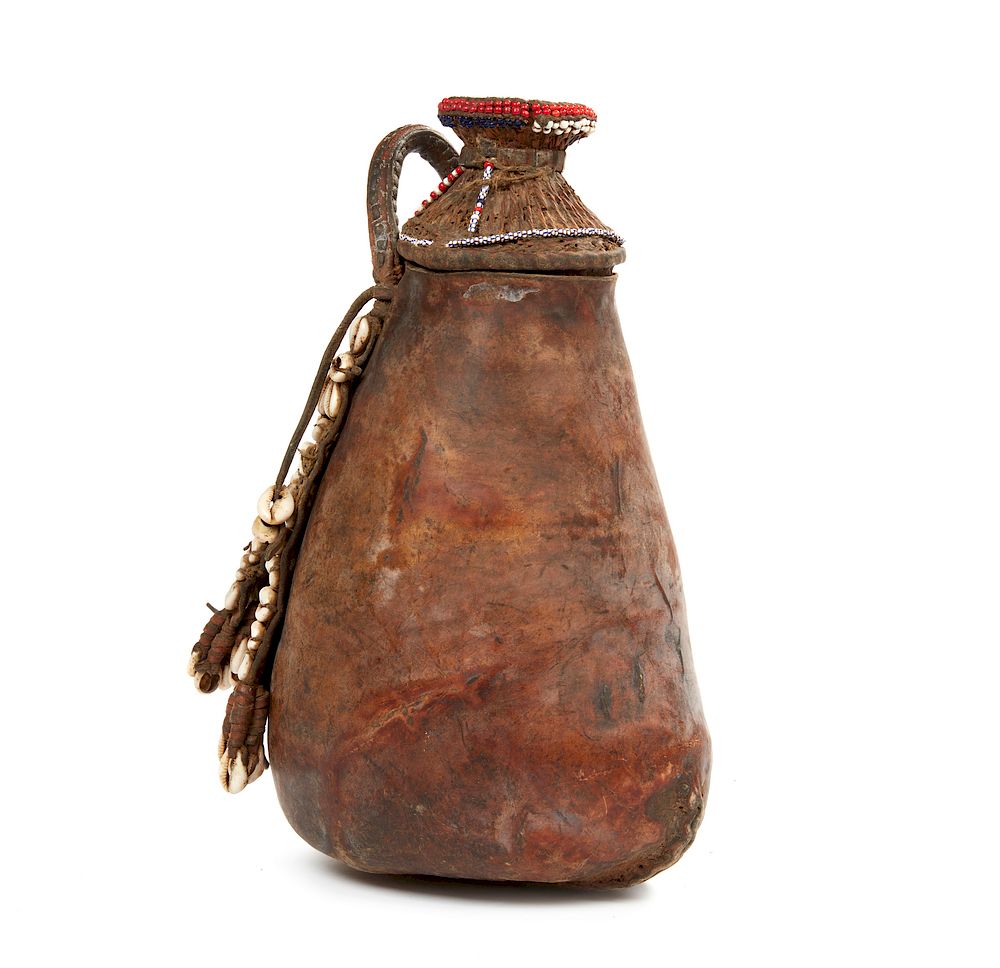 Appraisal: Maasai Leather Vessel Maasai lidded leather vessel accented with beadwork