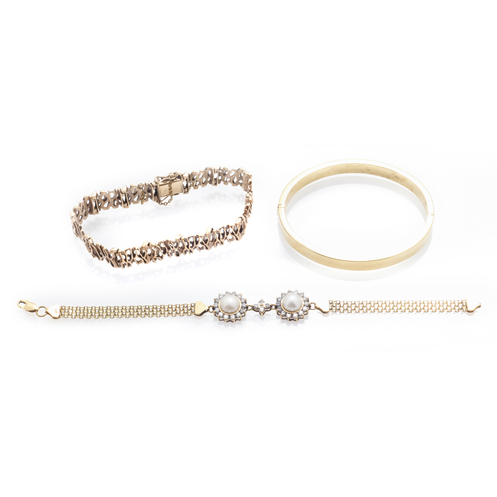 Appraisal: A collection of three bracelets to include a plain yellow