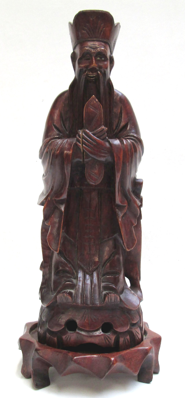 Appraisal: CHINESE WOOD CARVED IMMORTAL FIGURE featuring a robed man standing