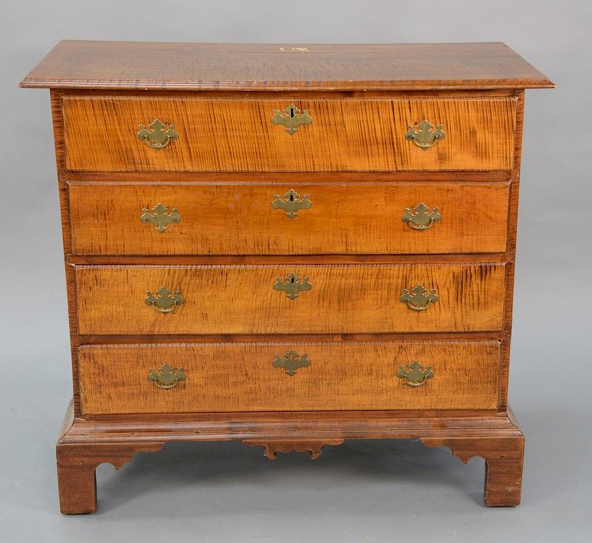 Appraisal: Tiger maple four drawer chest on bracket feet height in