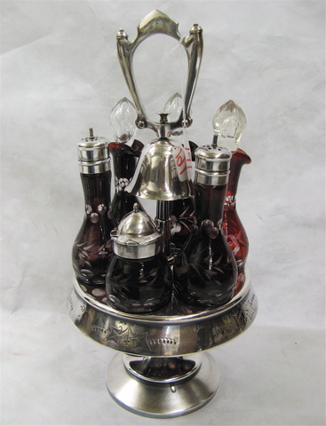 Appraisal: BOHEMIAN GLASS SILVER PLATED CASTOR SET having six red cut