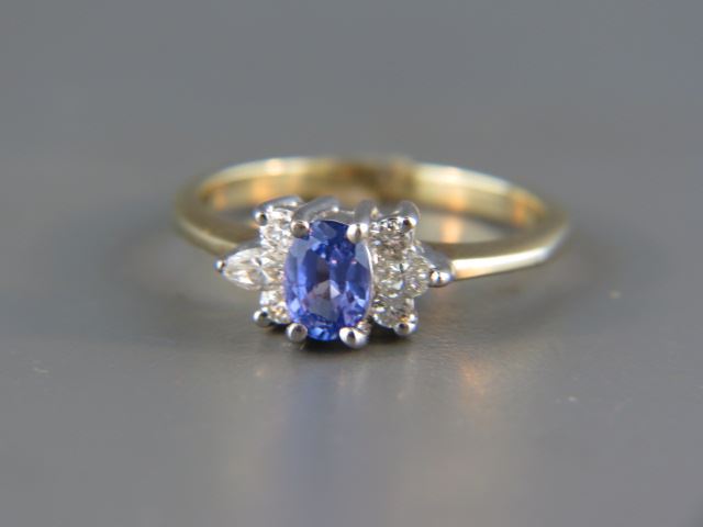 Appraisal: Tanzanite and Diamond Ring vivid oval carat gem with round