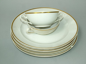 Appraisal: A Royal Copenhagen part dinner service with moulded border decoration