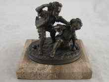 Appraisal: A bronze group of two boys fighting over a game