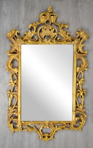 Appraisal: Decorative Arts Inc Carved Giltwood Mirror Rectangular neoclassical giltwood mirror