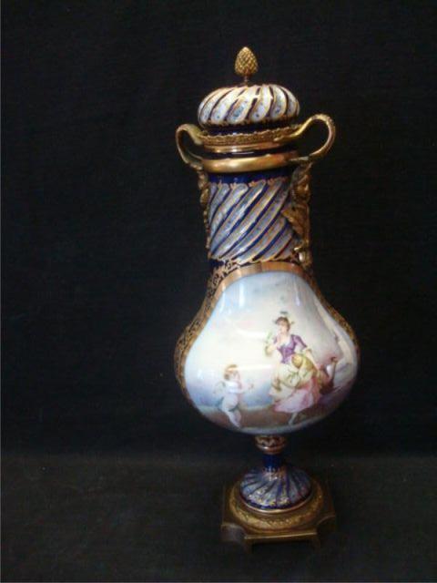 Appraisal: SEVRES Porcelain and Lidded Urn Decorated and bronze mounted From