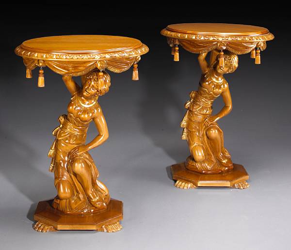 Appraisal: A pair of Rococo style walnut figural gueridons Each with