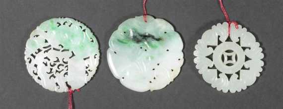 Appraisal: THREE WHITE AND GREEN JADEITE CICULAR PENDANTS China eraly th