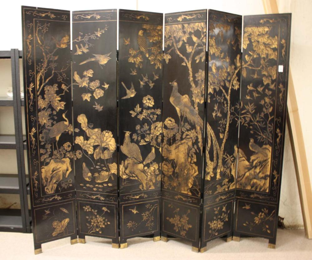 Appraisal: CHINESE SIX-PANEL COROMANDEL FLOOR SCREEN a black lacquer screen decorated