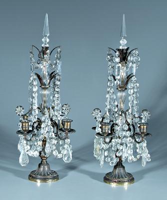 Appraisal: Pair brass candelabra four arms hung with cut glass prisms