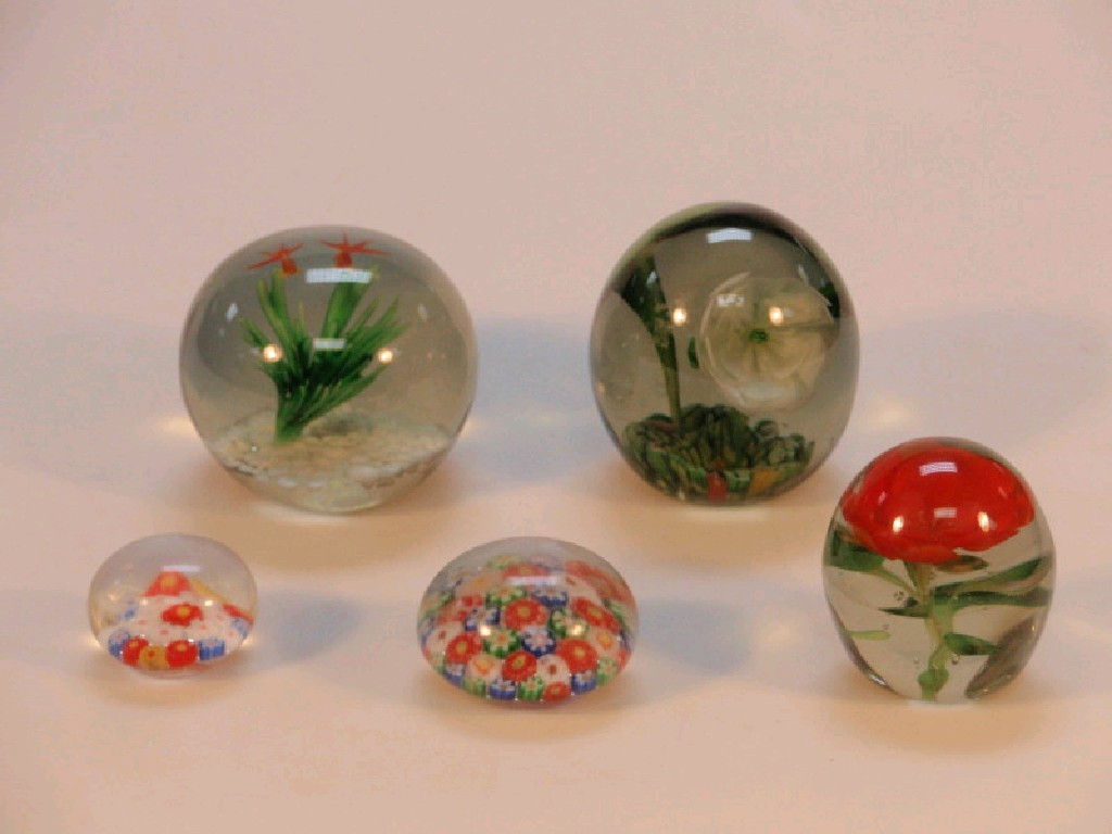 Appraisal: Five various glass paper weight including an example with fish