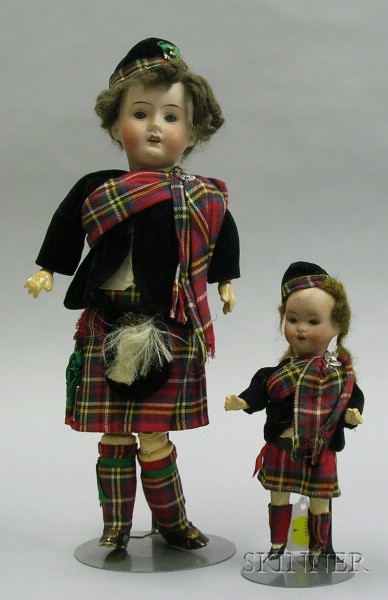 Appraisal: Two German Bisque Dolls in Scottish Dress one impressed Germany