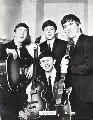 Appraisal: Beatles A black and white photograph of the Beatles c