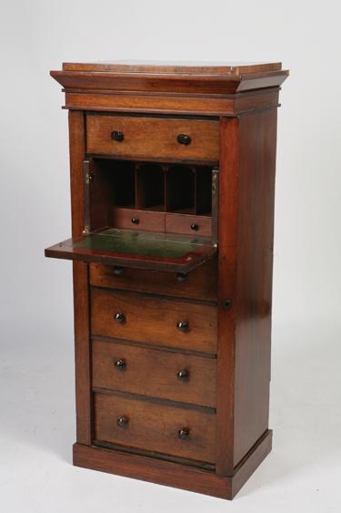 Appraisal: A VICTORIAN ROSEWOOD SECRETAIRE WELLINGTON CHEST the rectangular top with