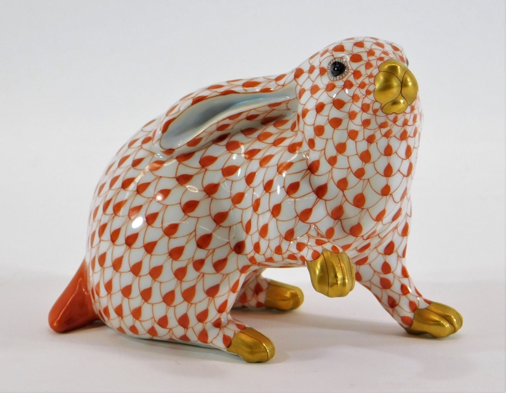 Appraisal: HEREND PORCELAIN ORANGE FISHNET BUNNY FIGURE Hungary th CenturyPoised standing